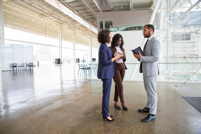 Business partners viewing commercial office space