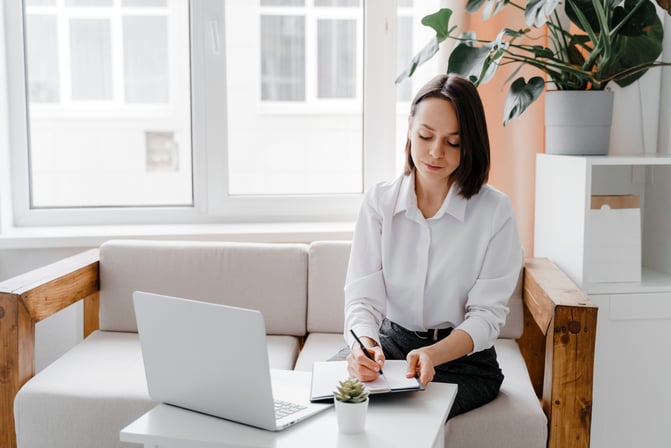 woman at home doing online research on mortgage rates